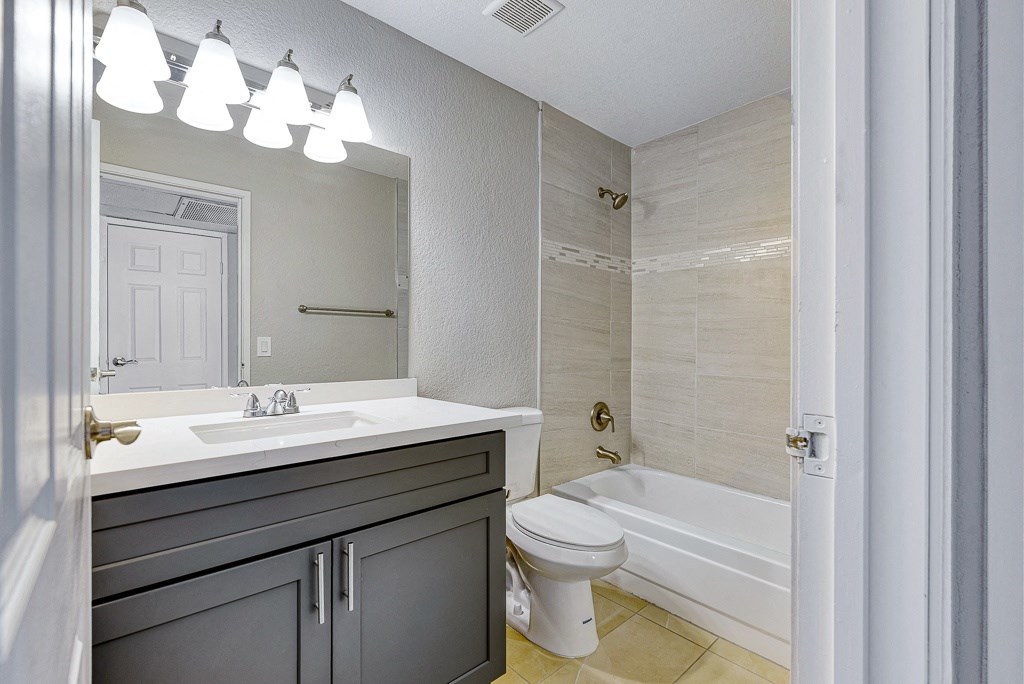 a bathroom with a sink toilet and a tub
