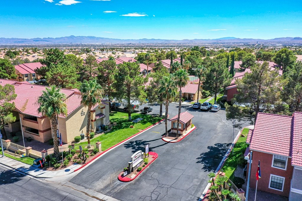 an aerial view of a neighborhood with houses and trees