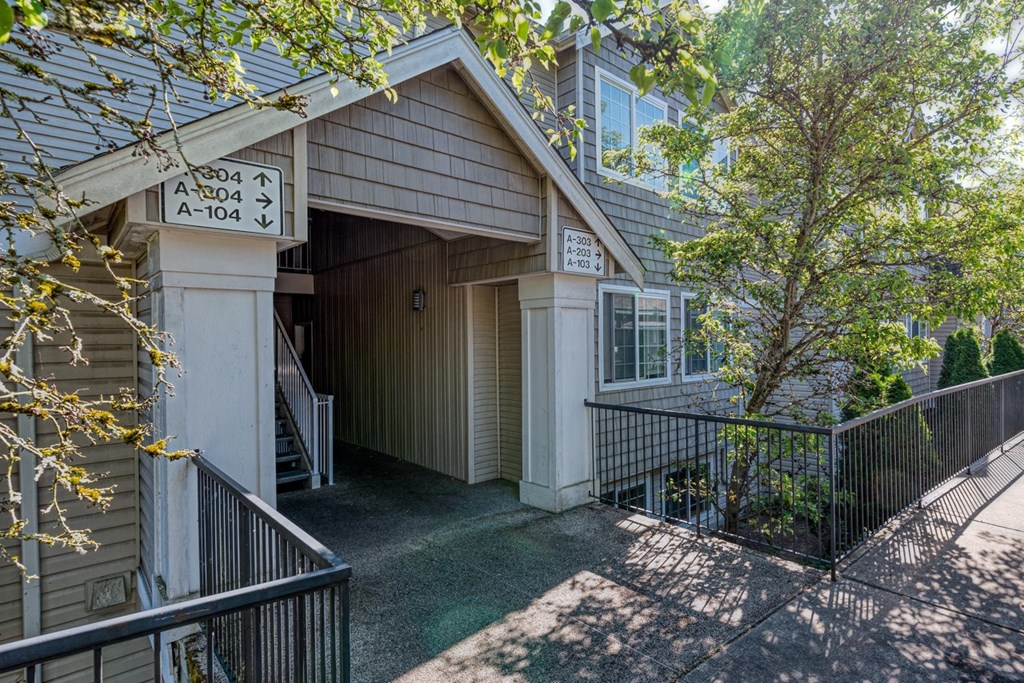 exterior entrance to property surrounded by trees