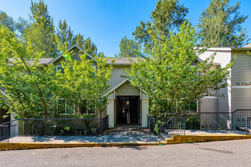 exterior entrance to property surrounded by trees