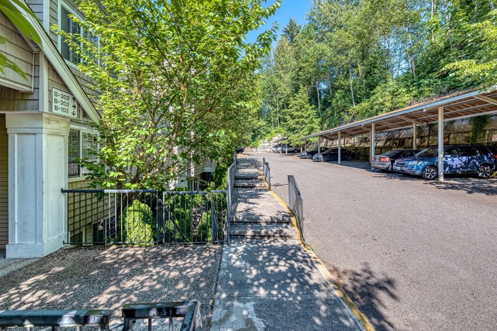 entrance to property with parking lot spaces nearby