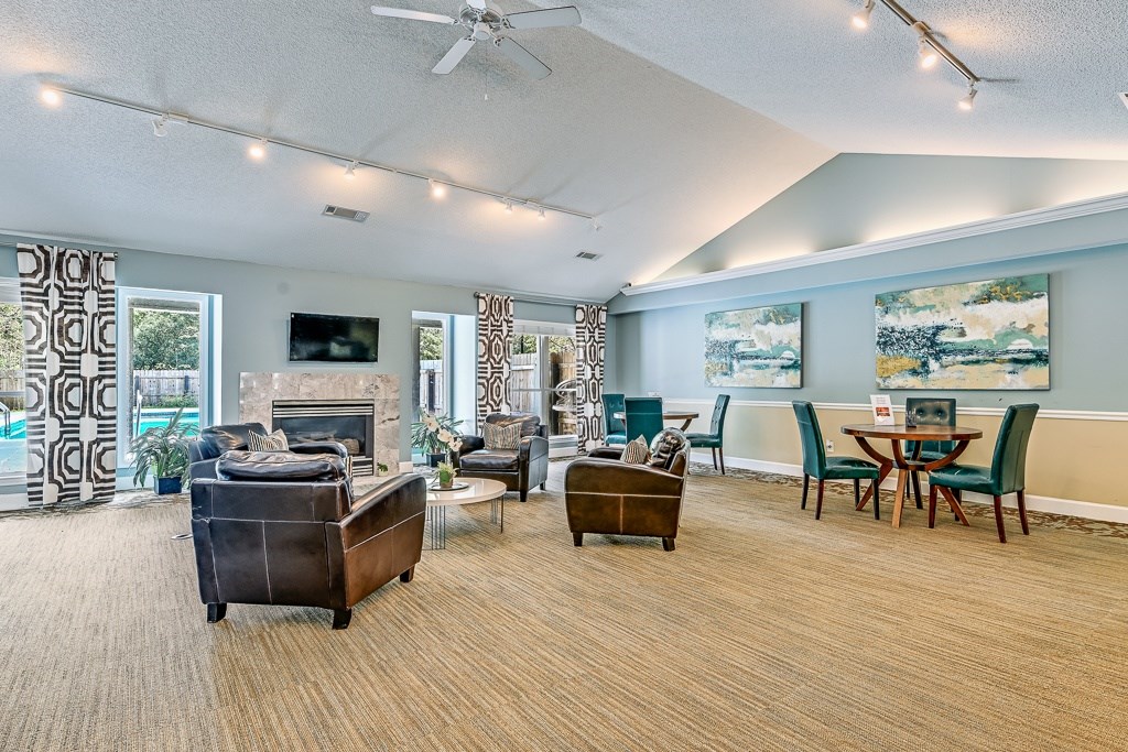 A living room with a fireplace and a television.