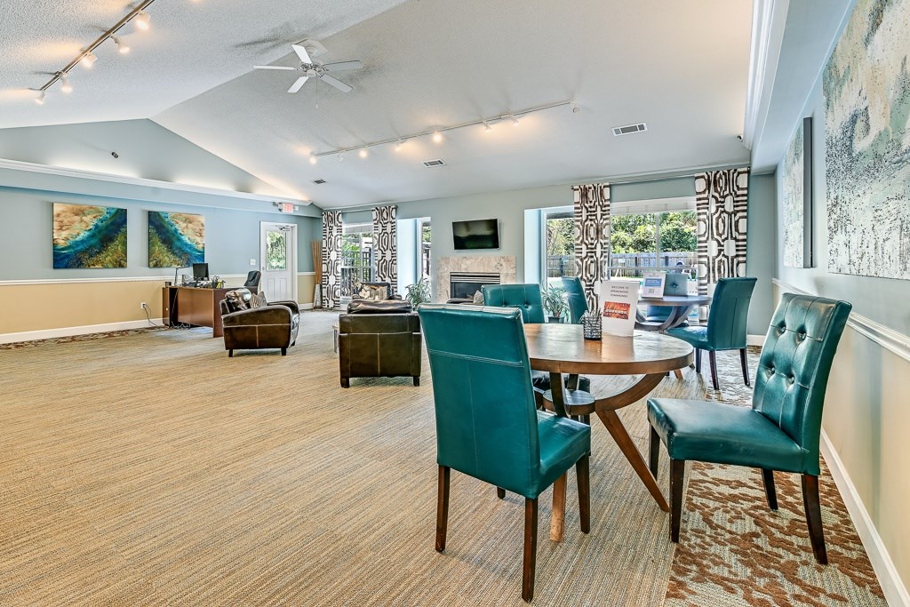 A room with a table and chairs in it.