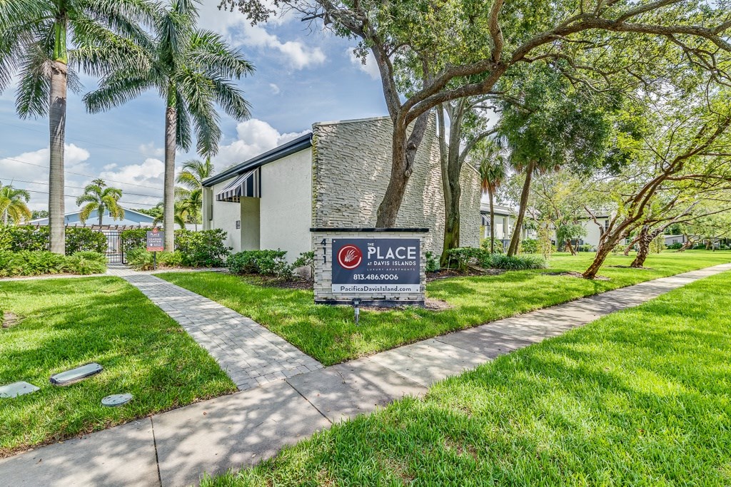 A sign in front of a building that says "PLACE" and "BETHESDA".