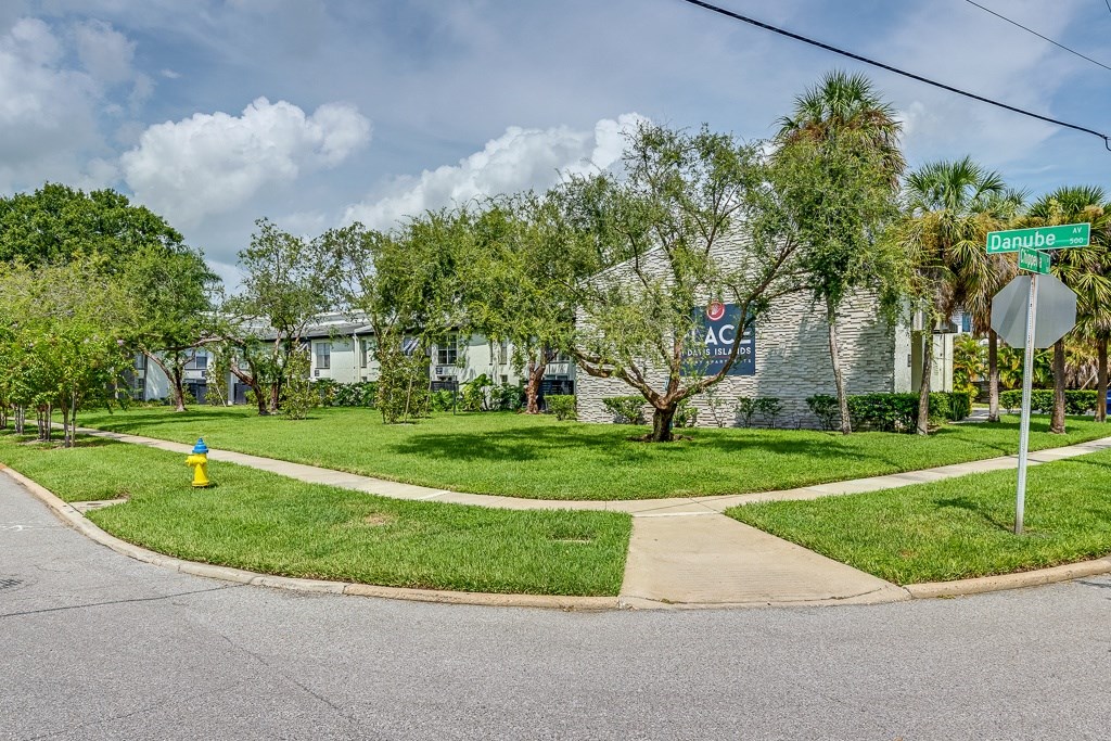 A street corner with a green street sign that says "Dunne".