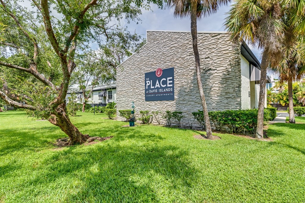 A sign that says Place in front of a building.