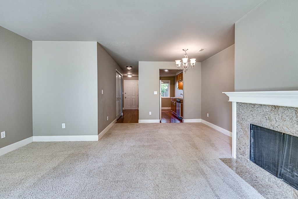 Living Room with Fireplace at Village at The Pointe Apartments, Tacoma, WA