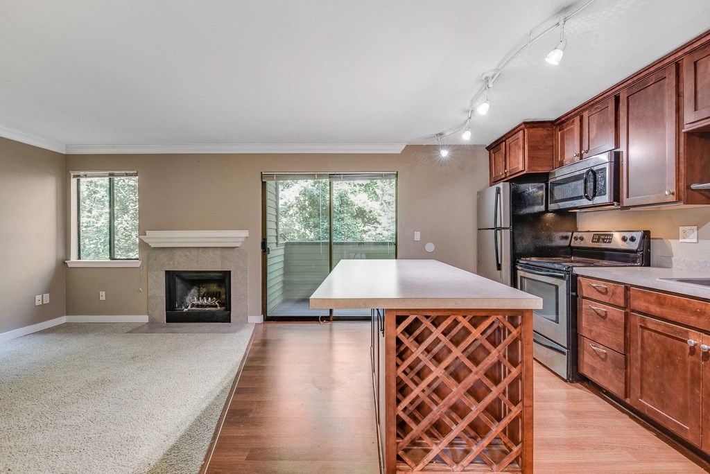 Kitchen and Living Room at Whispering Brook Apartments, Des Moines,98198