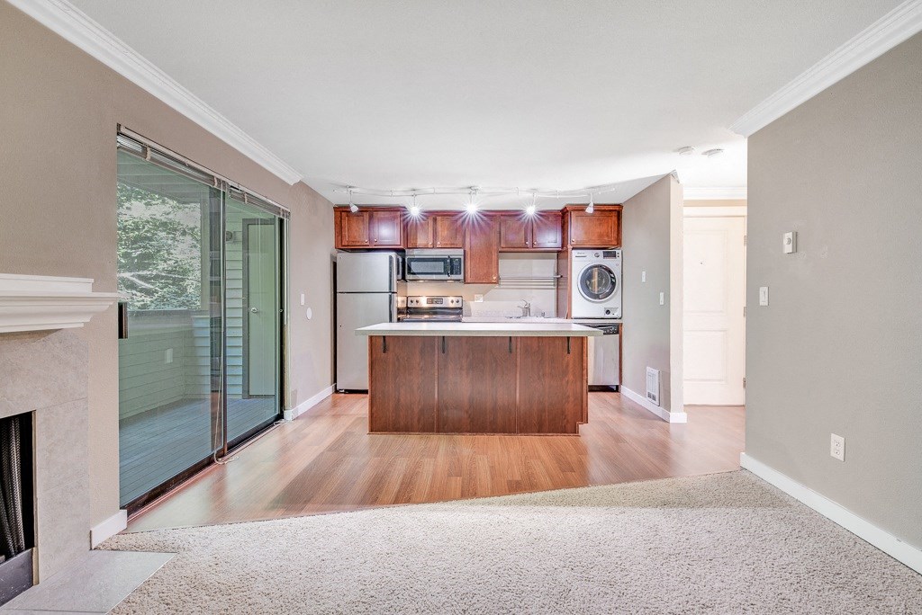 Kitchen, Living Room, Back Porch at Whispering Brook Apartments, Des Moines, Washington