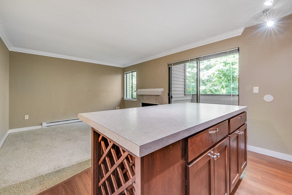 Wine Rack and Island Facing Living Room at Whispering Brook Apartments, Washington,98198