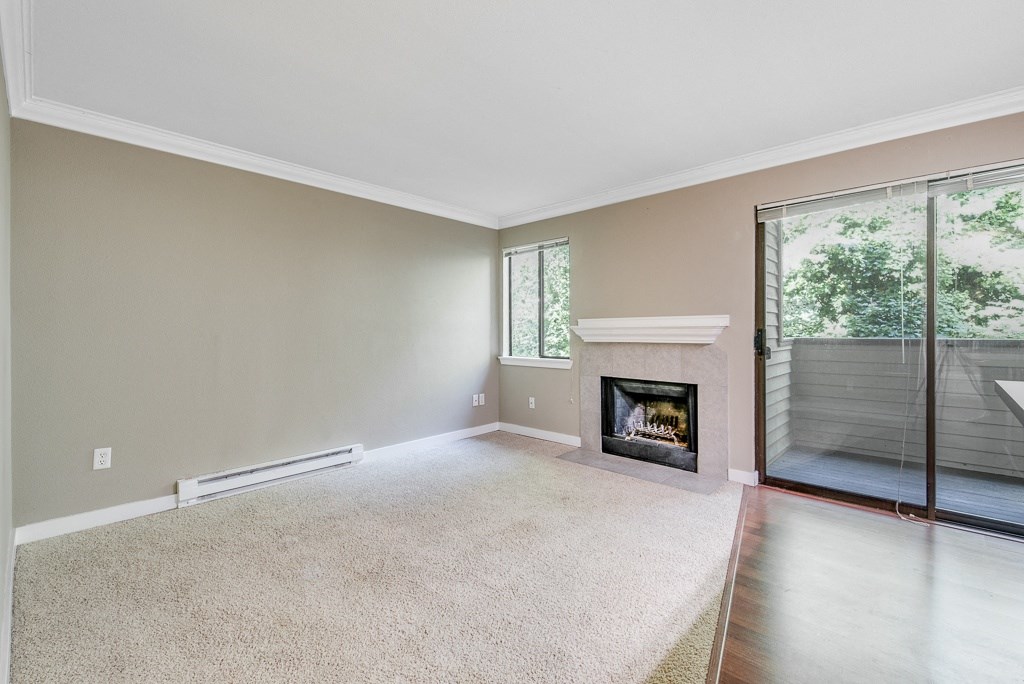 Fireplace and Outdoor Patio at Whispering Brook Apartments, Des Moines, Washington