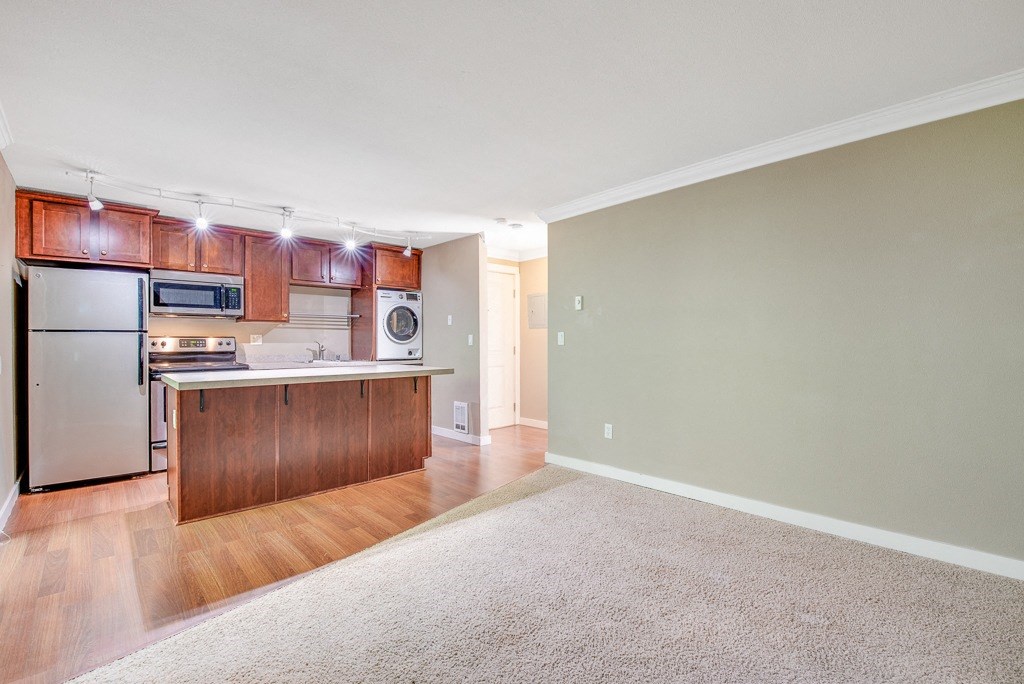 Living Room and Hallway at Whispering Brook Apartments, Des Moines, WA