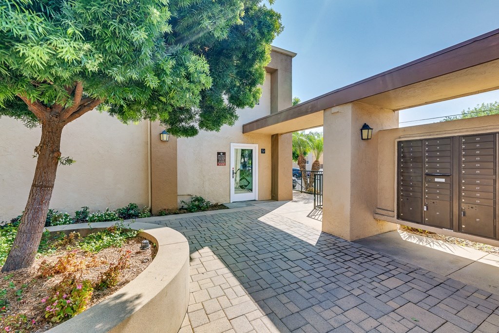 A house with a tree in front of it.