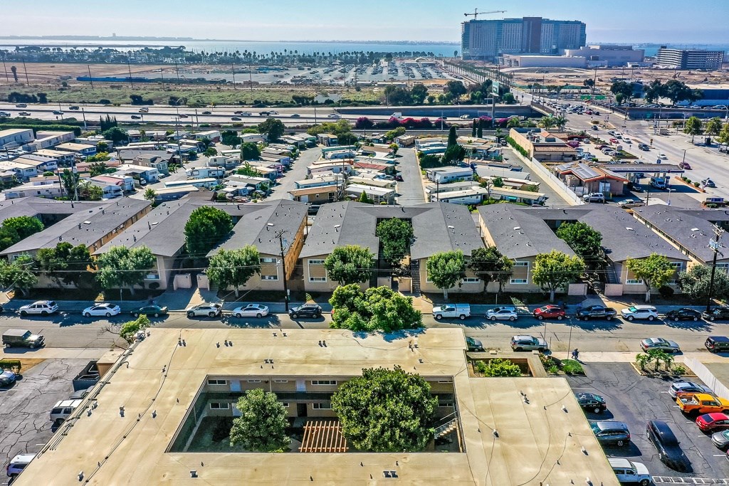 A parking lot with cars and a building in the background.