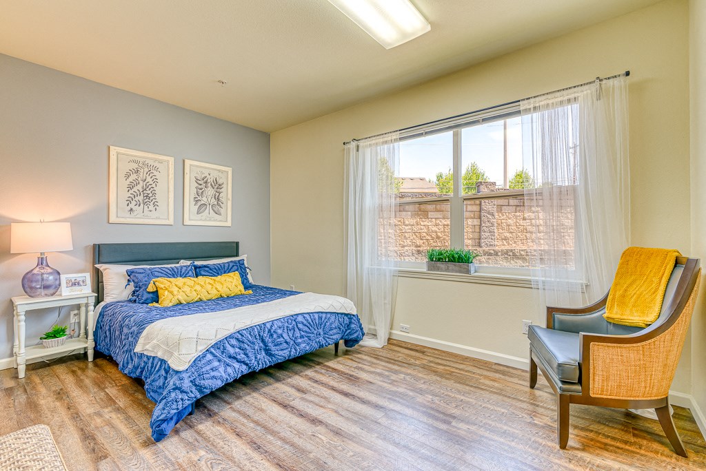 bedroom with open window and large bed