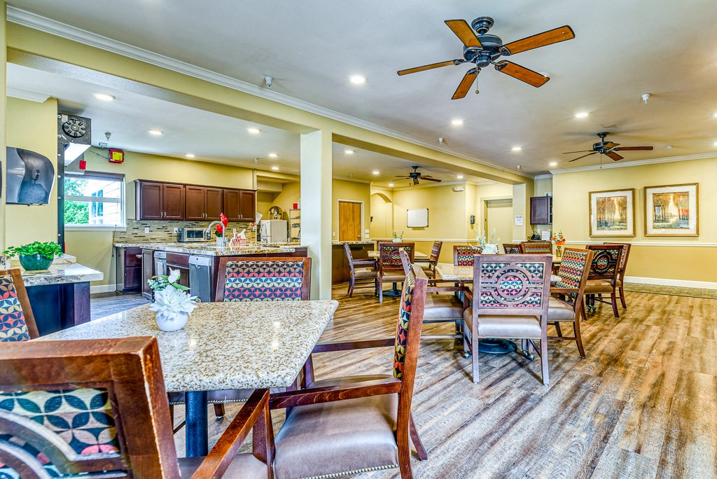 dining room with multiple sets of chairs and tables