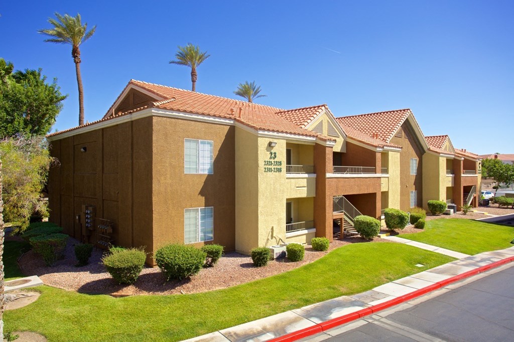 a building with palm trees in the background