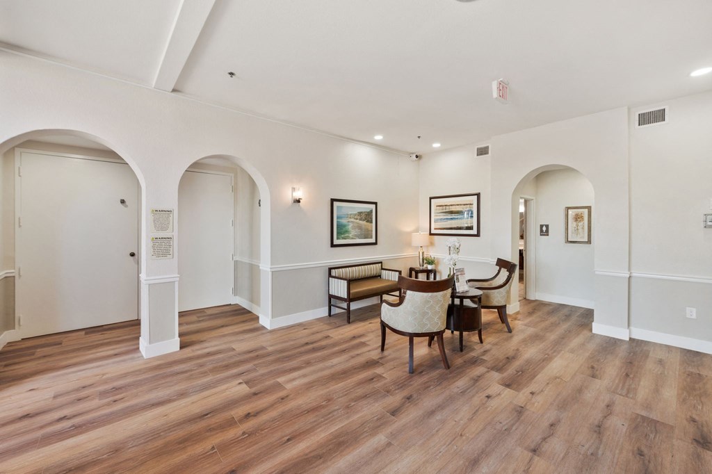 a living room with hardwood floors and white walls at Azure Point at Encinitas, California, 92024
