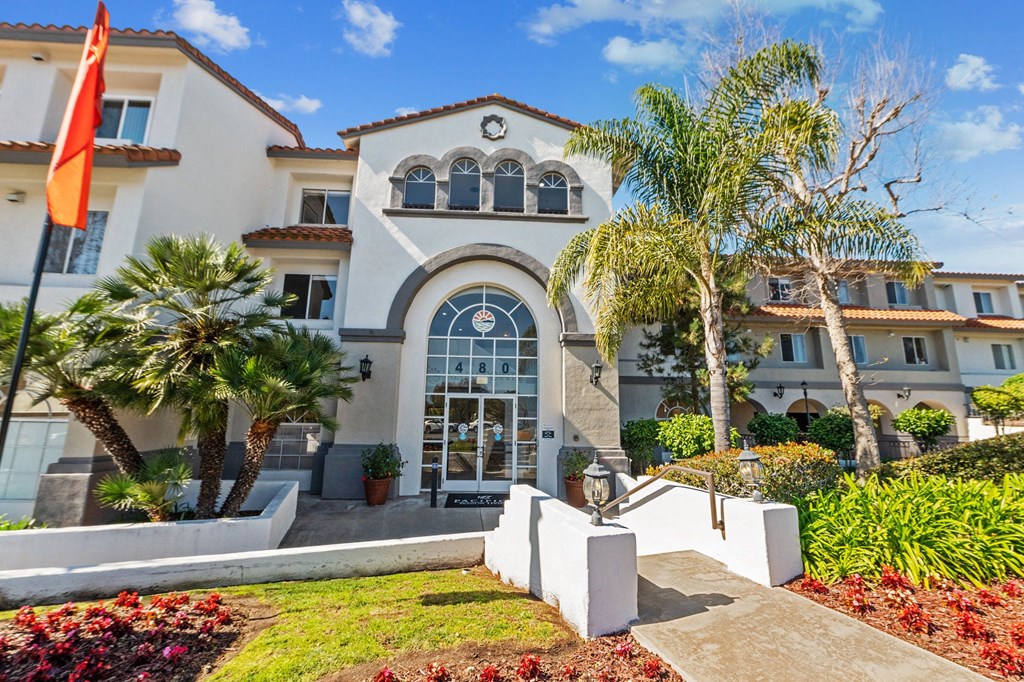 an  apartment building with palm trees in front of it at Azure Point at Encinitas, Encinitas, CA