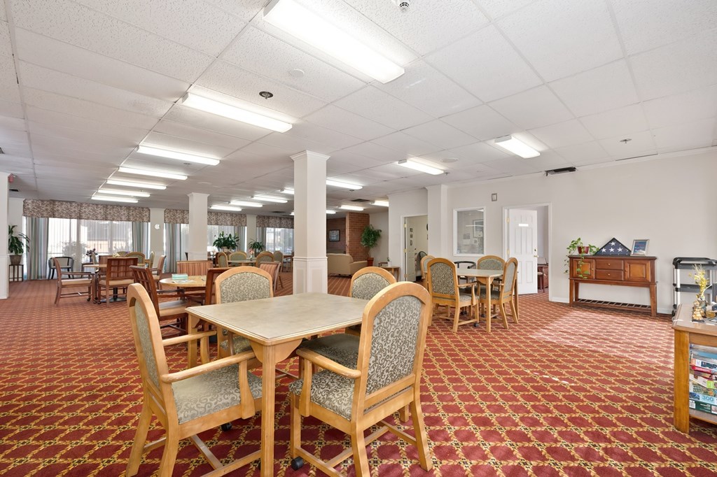 A room with a table and chairs in it.