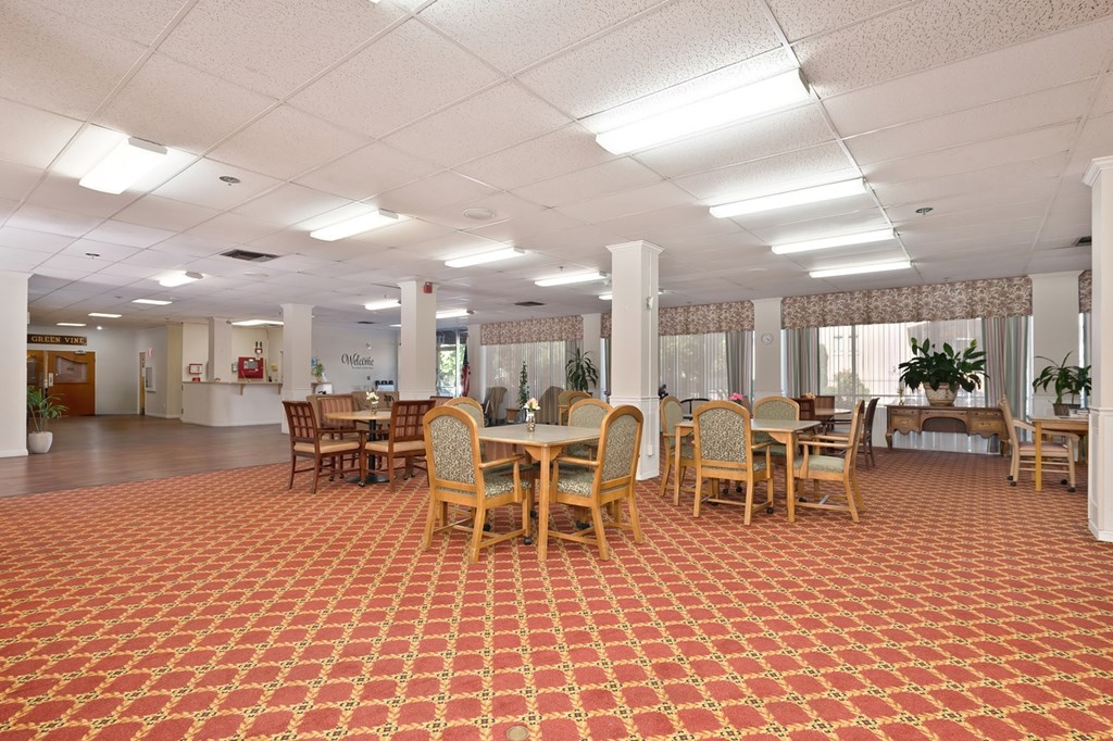 A large room with tables and chairs.
