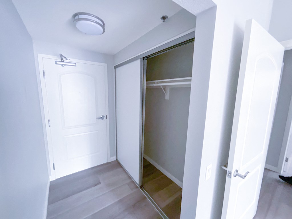 a walk in closet in a 555 waverly unit