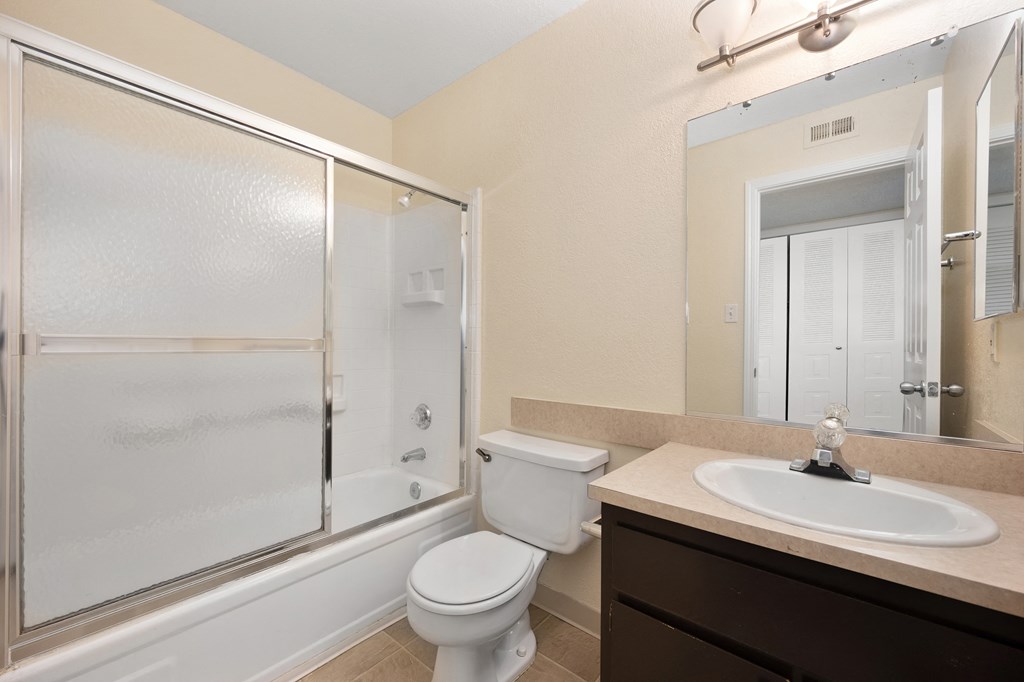 the preserve at ballantyne commons apartment bathroom with sink toilet and shower