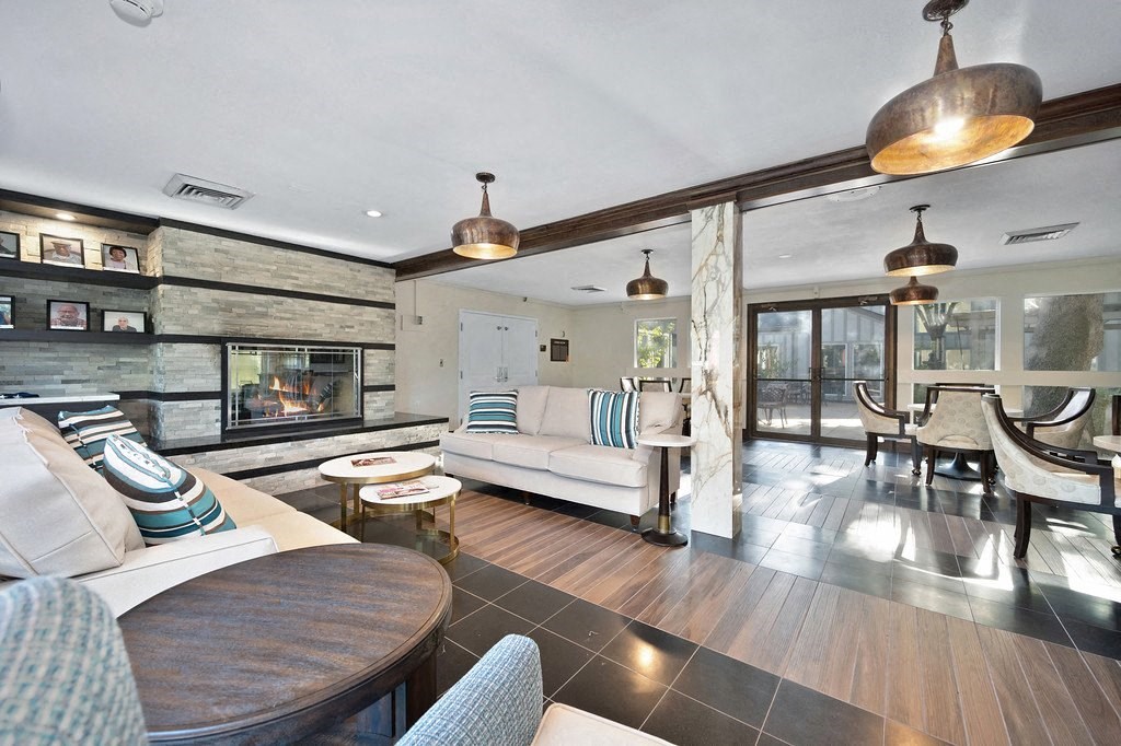 a living room filled with furniture and a large window at Citrus Heights Apartments, Citrus Heights, California