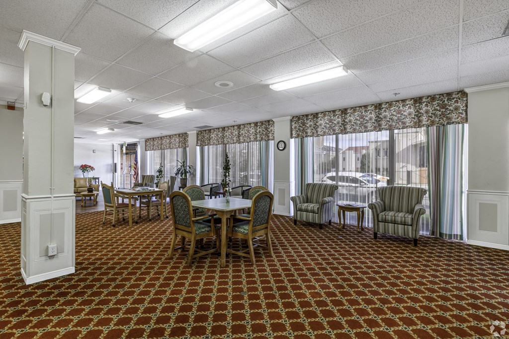 a conference room with a table and chairs