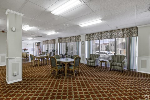 a conference room with a table and chairs