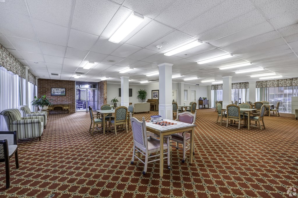 a large room with a table and chairs in it