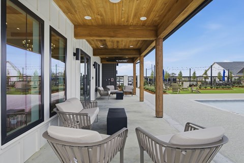A patio with a table and chairs is shown.