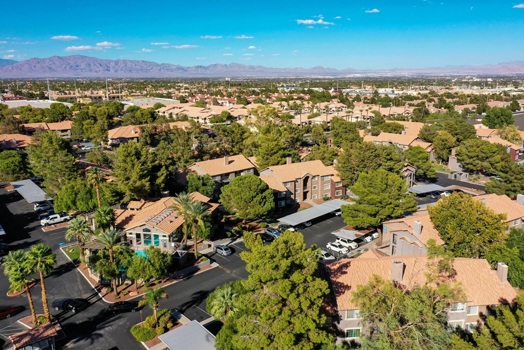 A bird's eye view of a residential area with houses and trees.