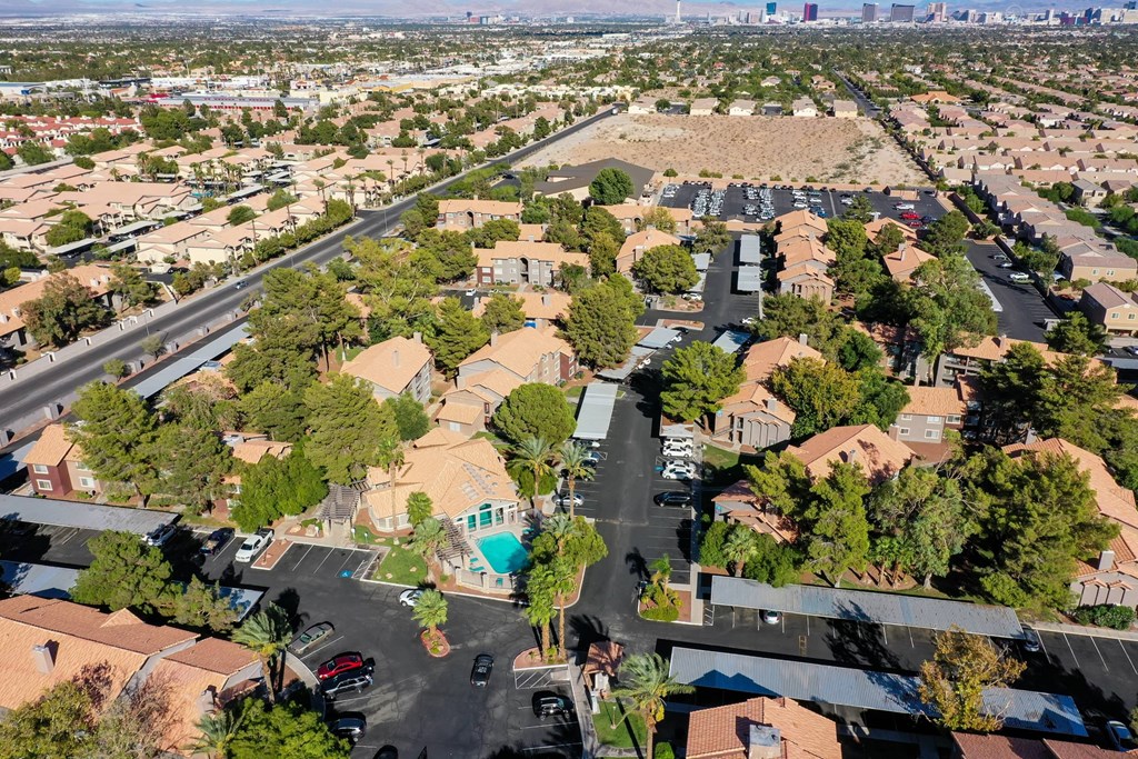 A bird's eye view of a residential area with houses and streets.