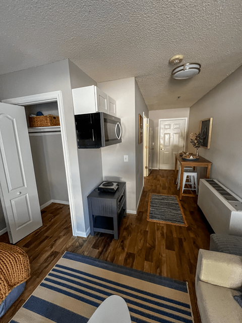 an overhead view of a living room and a kitchen