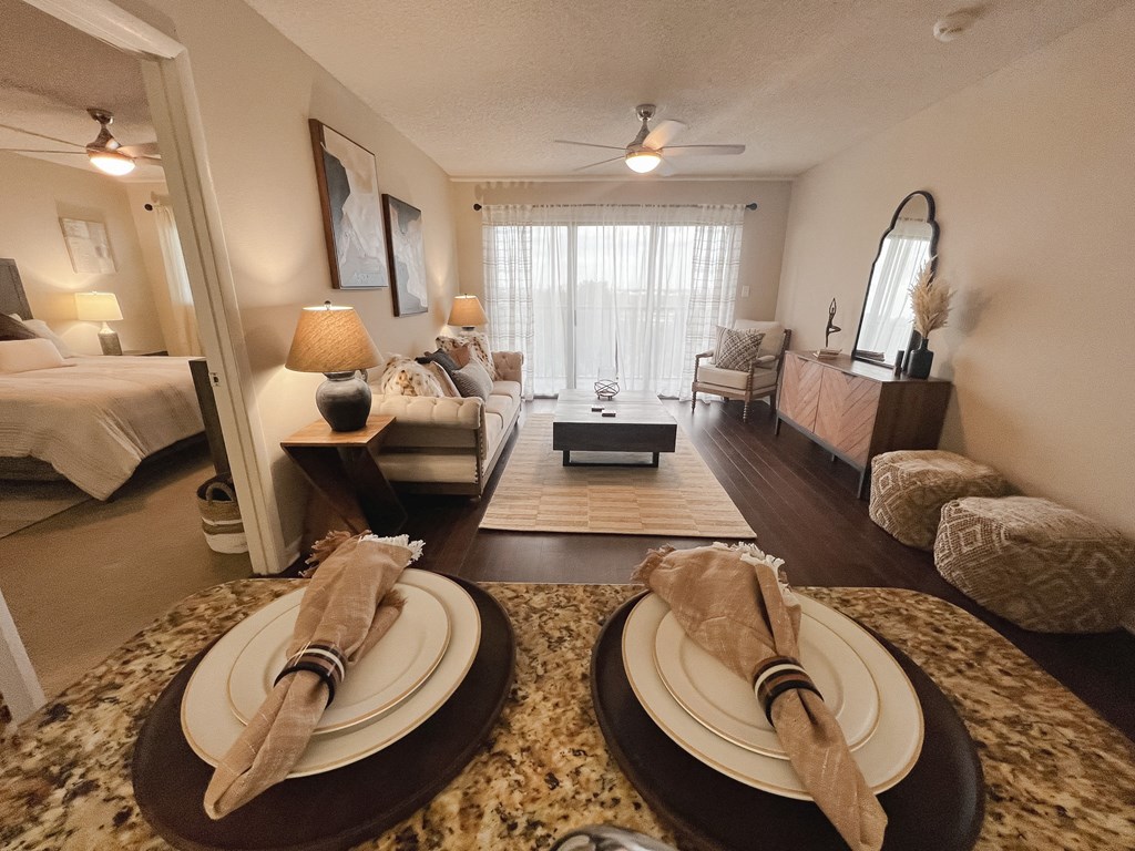 a living room with a table with plates on it
