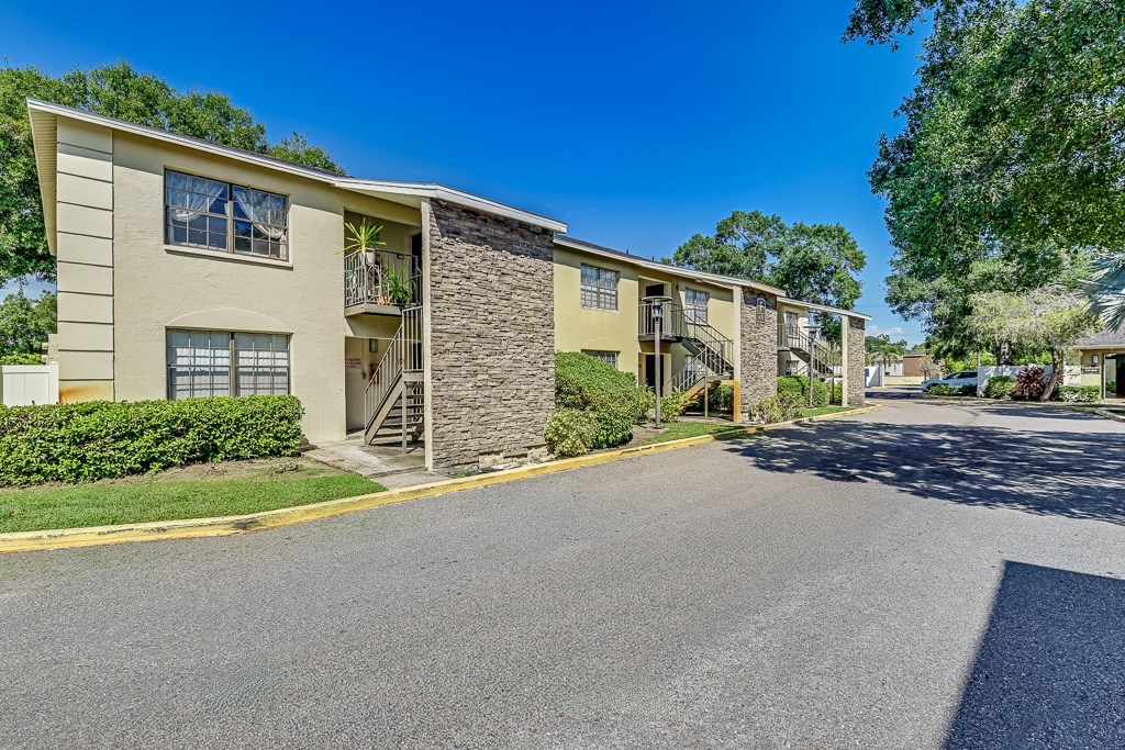 A sunny day at the apartment complex with clear blue skies.