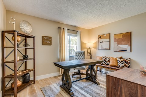 the living room has a large window for plenty of natural light