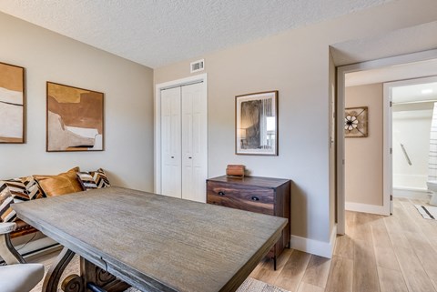 a dining room with a table and chairs