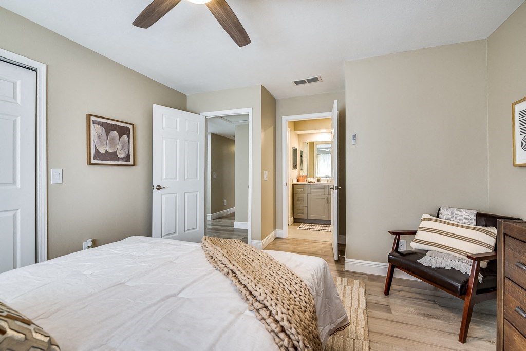 a bedroom with a bed and a chair