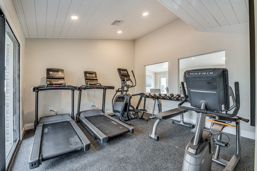 the gym at the enclave at woodbridge apartments in sugar land, tx