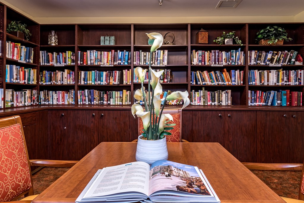 a table with an open book on it in a library