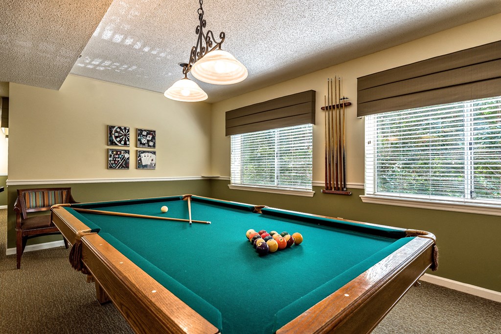an air conditioned game room with a pool table