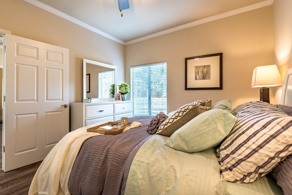 a bedroom with a large bed and a closet