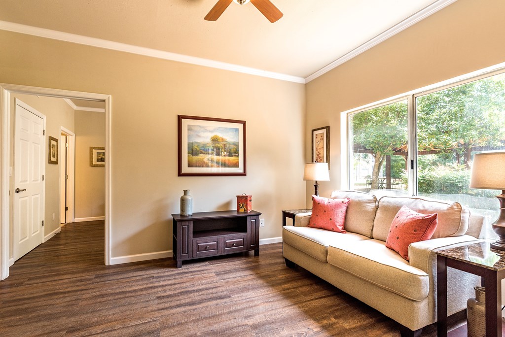 a living room with a couch and a window
