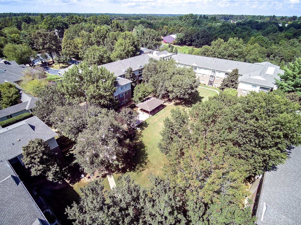 an aerial view of a neighborhood with trees and houses
