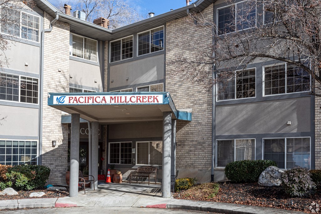 a building with a sign that reads in front of it