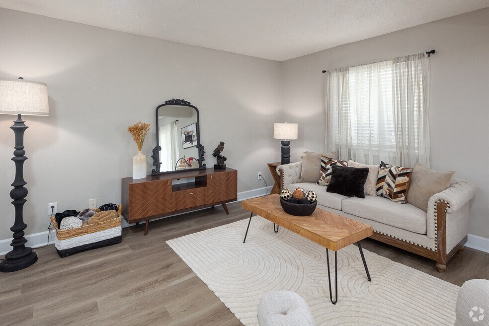 a living room with a couch and a table