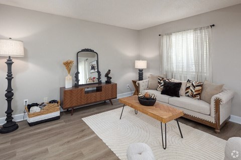 a living room with a couch and a table