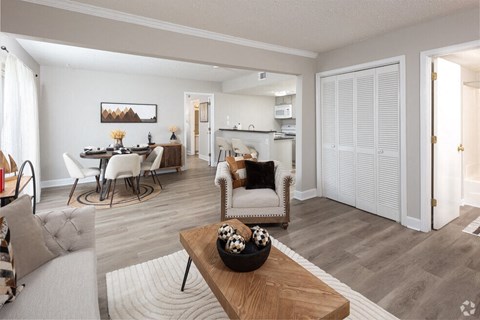 a living room with a dining room and a kitchen